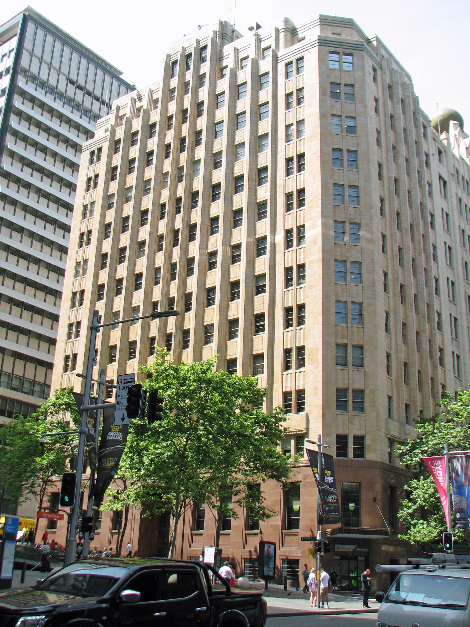 APA House, 53 Martin Place, Sydney — a tall art deco building in sand-coloured stone, situated on Martin Place.